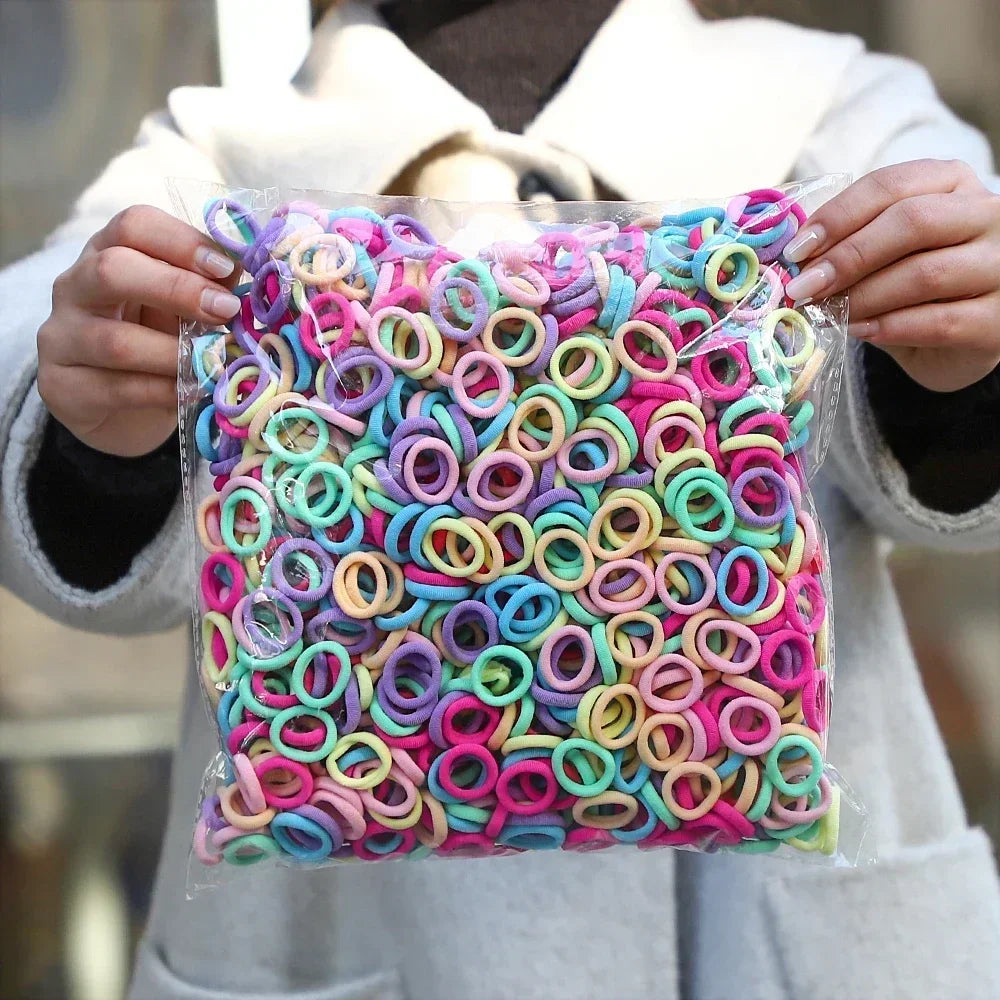 Colorful nylon elastic hair bands for women and girls arranged in a variety of bright colors